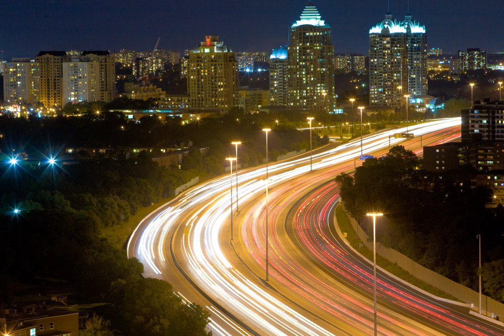 A timelapse photo of a busy multilane highway at night